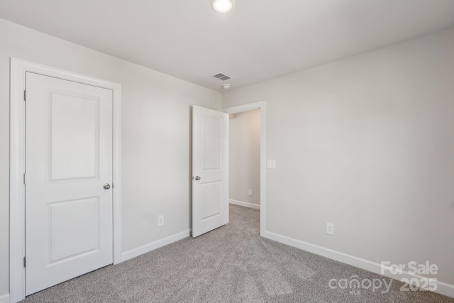 1305 31st St NE, Conover, NC 28613 - unfurnished bedroom with carpet, visible vents, and baseboards