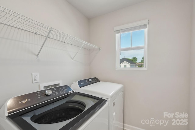 1305 31st St NE, Conover, NC 28613 - laundry room with washing machine and clothes dryer, baseboards, and laundry area