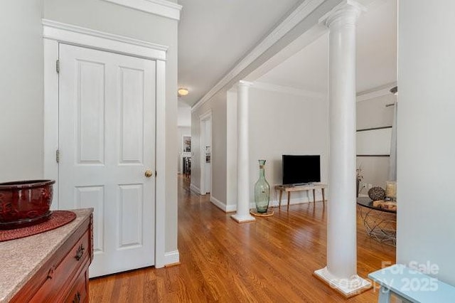 10802 Tradition View Dr, Charlotte, NC 28269 - hall featuring baseboards, crown molding, light wood-style floors, and ornate columns