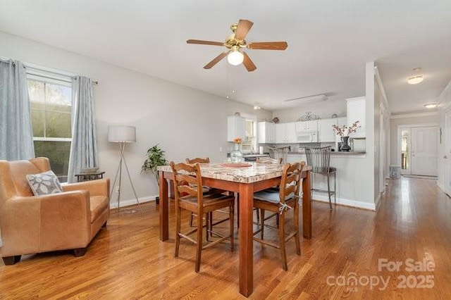 10802 Tradition View Dr, Charlotte, NC 28269 - dining space with light wood-type flooring, baseboards, and ceiling fan