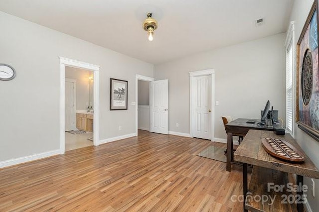 10802 Tradition View Dr, Charlotte, NC 28269 - home office with light wood finished floors, baseboards, and visible vents
