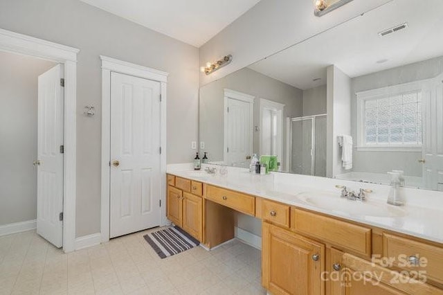 10802 Tradition View Dr, Charlotte, NC 28269 - full bathroom featuring a sink, a shower stall, baseboards, visible vents, and double vanity