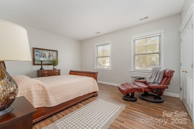 10802 Tradition View Dr, Charlotte, NC 28269 - bedroom featuring baseboards, visible vents, and wood finished floors