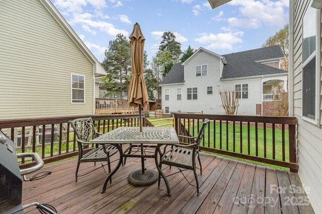 10802 Tradition View Dr, Charlotte, NC 28269 - deck with a lawn and outdoor dining area