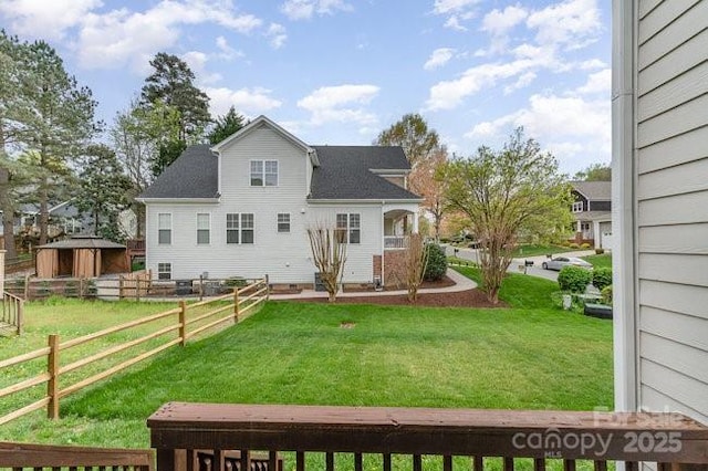 10802 Tradition View Dr, Charlotte, NC 28269 - back of property with an outdoor structure, fence, and a yard