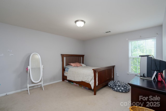 bedroom with visible vents and carpet floors