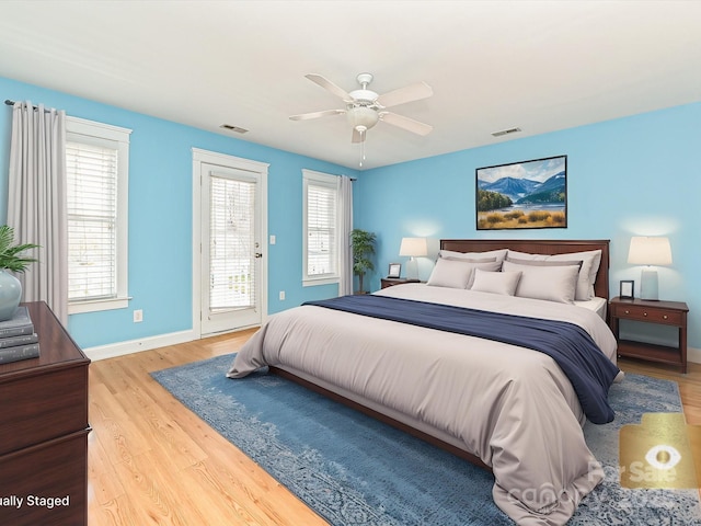 10133 Caldwell Forest Rd, Charlotte, NC 28213 - bedroom featuring access to exterior, light wood-style flooring, multiple windows, and baseboards