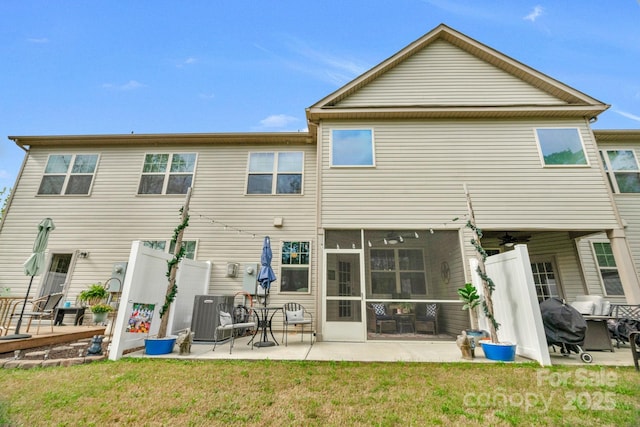 6021 Sweetbay Ln, Indian Land, SC 29707 - rear view of house with cooling unit, a patio, a sunroom, and a lawn