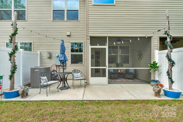 6021 Sweetbay Ln, Indian Land, SC 29707 - back of house with fence, a sunroom, a patio, and central AC