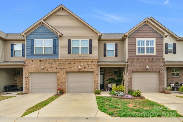6021 Sweetbay Ln, Indian Land, SC 29707 - view of property with brick siding, concrete driveway, and a garage