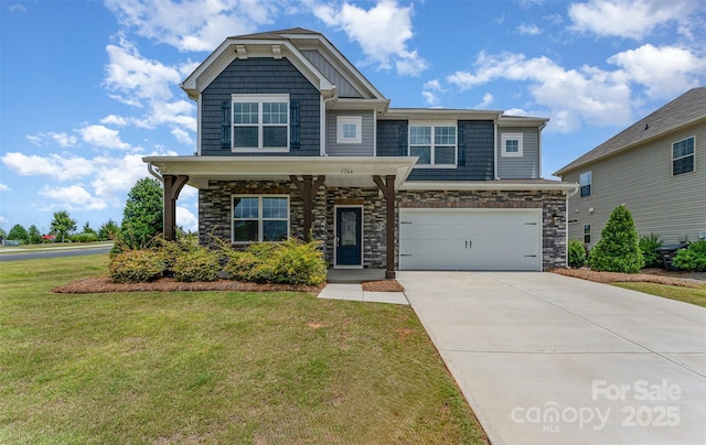 1766 Loggerhead Dr, Lancaster, SC 29720 - craftsman-style home with a front yard, concrete driveway, a garage, and stone siding