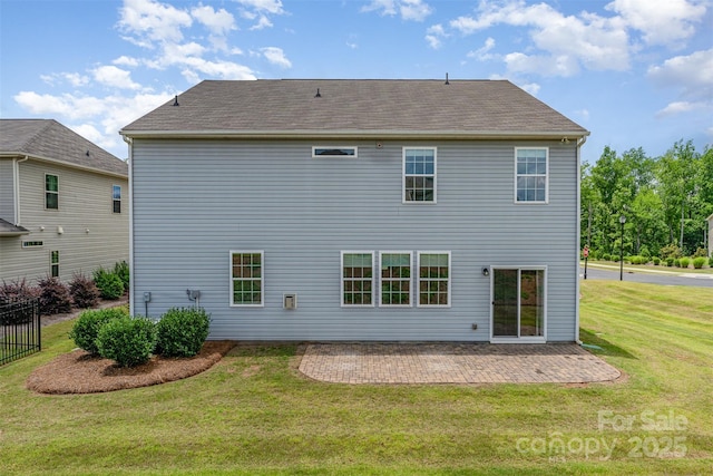 1766 Loggerhead Dr, Lancaster, SC 29720 - rear view of house with a yard, a patio, and a shingled roof