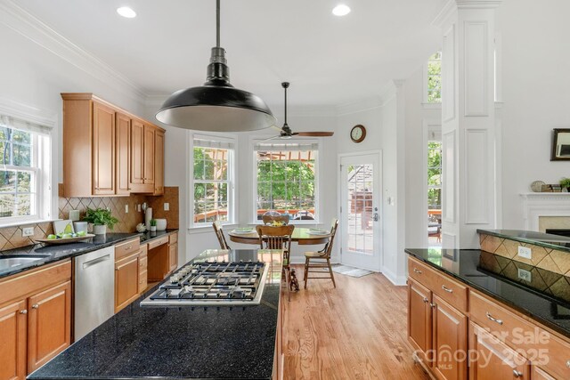 kitchen featuring light wood-style floors, recessed lighting, appliances with stainless steel finishes, and backsplash