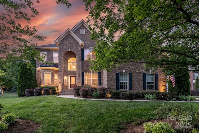 3017 Chisholm Ct, Waxhaw, NC 28173 - view of front facade featuring a lawn and brick siding