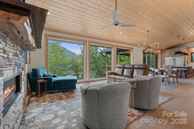 192 Lakeview Trl, Bryson City, NC 28713 - living area featuring wooden ceiling, a fireplace, lofted ceiling, ceiling fan, and recessed lighting