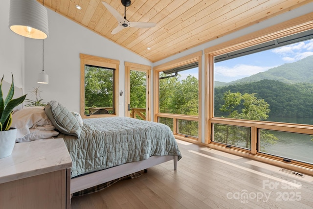192 Lakeview Trl, Bryson City, NC 28713 - bedroom with wood ceiling, lofted ceiling, a mountain view, multiple windows, and hardwood / wood-style flooring