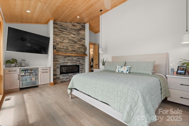 192 Lakeview Trl, Bryson City, NC 28713 - bedroom with wine cooler, wooden ceiling, lofted ceiling, light wood-style floors, and a dry bar