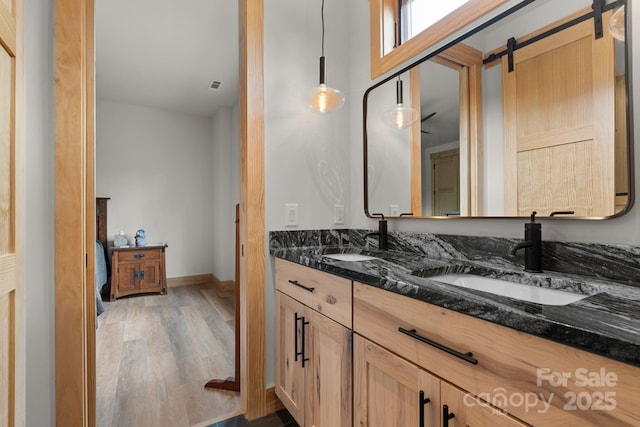 192 Lakeview Trl, Bryson City, NC 28713 - full bathroom featuring double vanity, wood finished floors, and baseboards