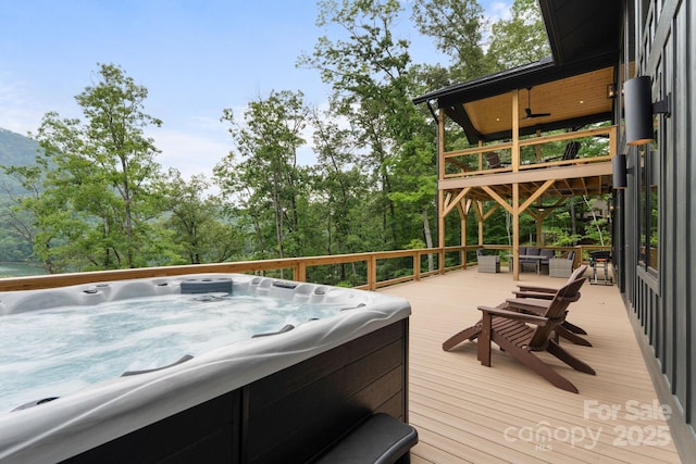 192 Lakeview Trl, Bryson City, NC 28713 - deck with a hot tub and view of wooded area