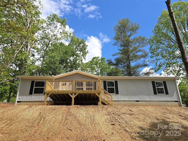 manufactured / mobile home with crawl space and a deck