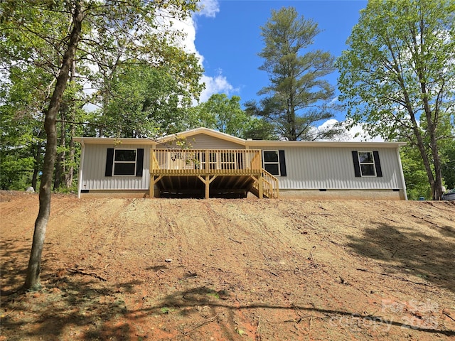 view of front of property with crawl space and a deck