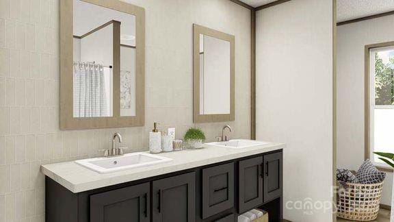 full bathroom with double vanity and tile walls