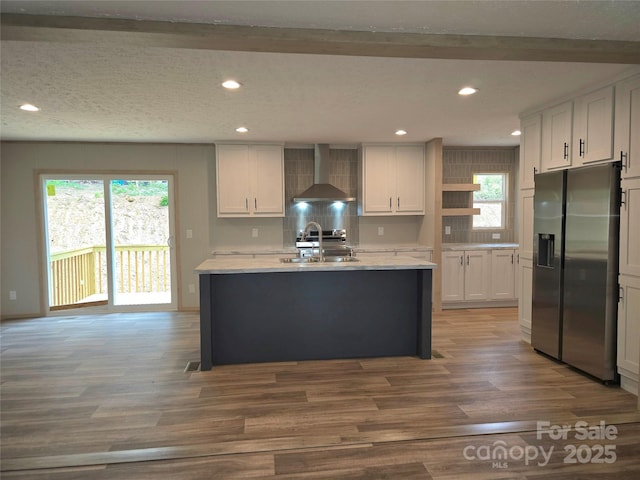 28 Mcgee Hill Rd, Fairview, NC 28730 - kitchen with stainless steel fridge, wall chimney range hood, open shelves, a sink, and wood finished floors