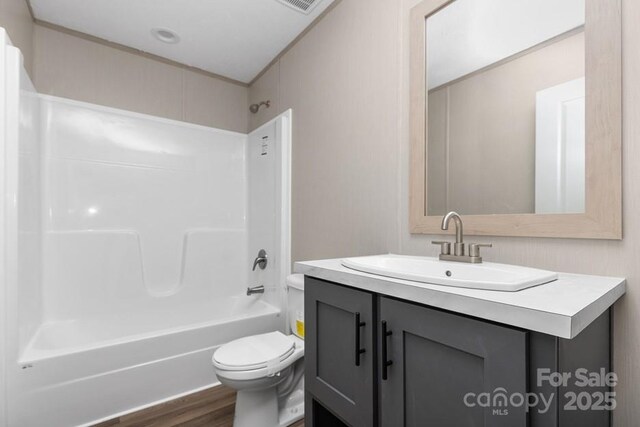 28 Mcgee Hill Rd, Fairview, NC 28730 - bathroom with vanity, toilet, shower / bath combination, and wood finished floors
