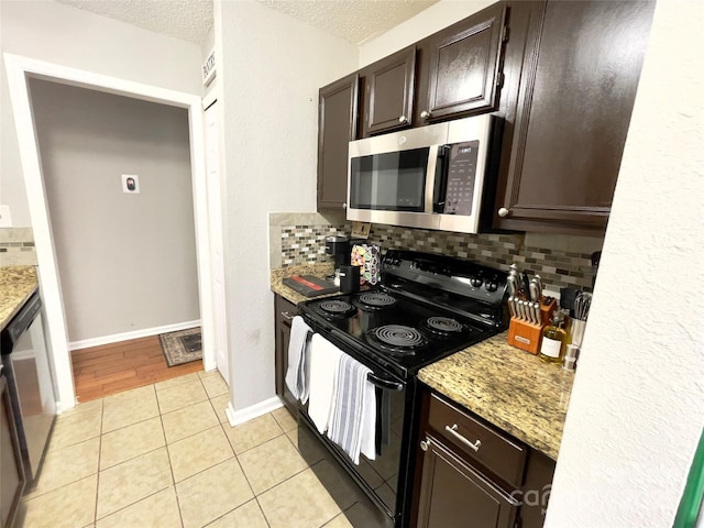 218 Cottonwood Park Dr, Charlotte, NC 28214 - kitchen featuring decorative backsplash, a textured ceiling, dark brown cabinetry, and stainless steel appliances