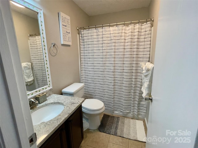 218 Cottonwood Park Dr, Charlotte, NC 28214 - bathroom featuring tile patterned floors, toilet, vanity, and a textured ceiling