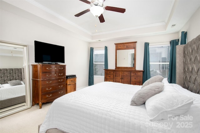 128 Millen Dr, Mooresville, NC 28115 - bedroom with light carpet, a raised ceiling, multiple windows, a ceiling fan, and ornamental molding
