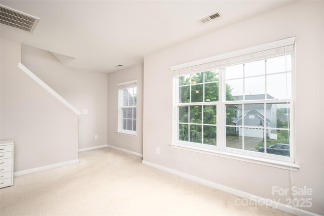 128 Millen Dr, Mooresville, NC 28115 - unfurnished living room with baseboards and light carpet