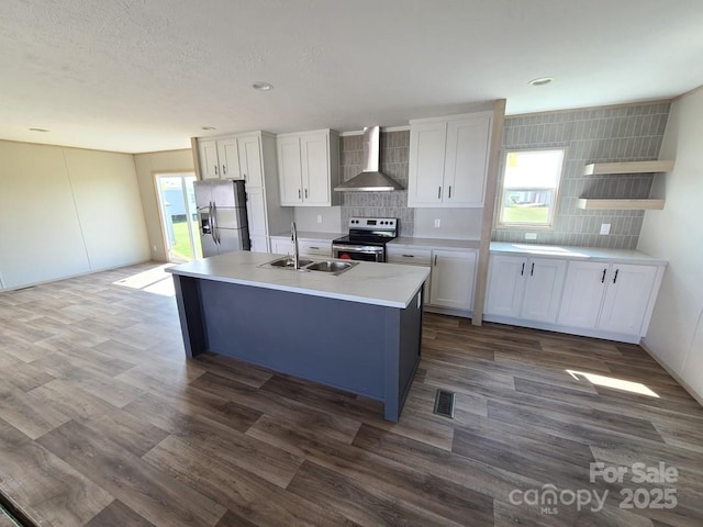 22 Mcgee Hill Rd, Fairview, NC 28730 - kitchen featuring appliances with stainless steel finishes, wall chimney range hood, backsplash, dark wood-type flooring, and light countertops