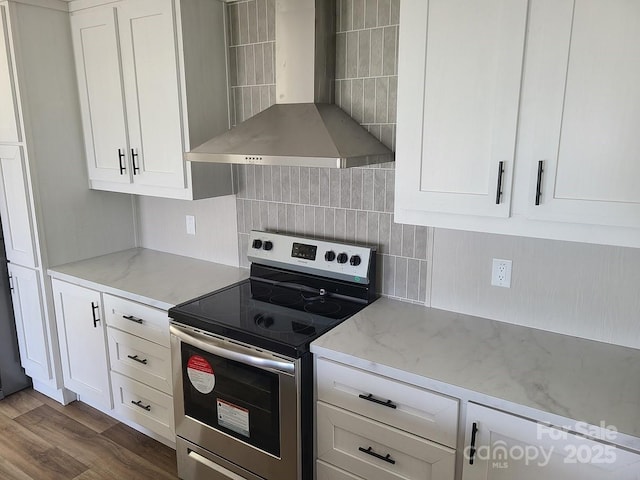 22 Mcgee Hill Rd, Fairview, NC 28730 - kitchen featuring wall chimney exhaust hood, stainless steel electric range, decorative backsplash, and white cabinetry