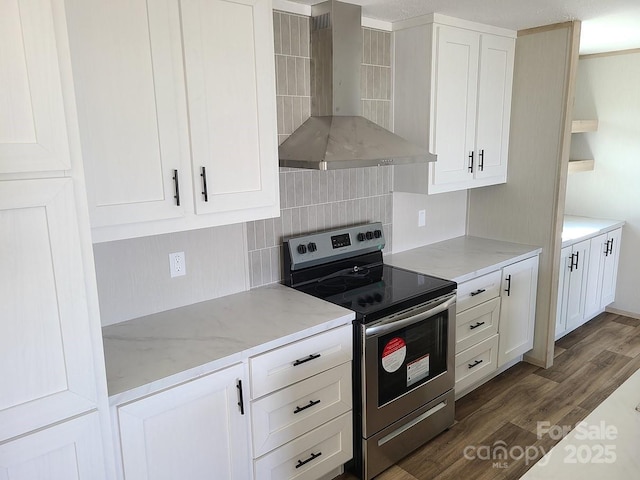 22 Mcgee Hill Rd, Fairview, NC 28730 - kitchen with wall chimney range hood, stainless steel electric range oven, dark wood finished floors, white cabinets, and tasteful backsplash