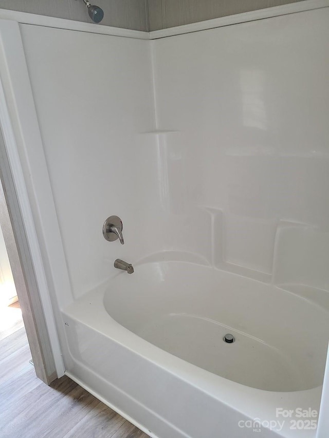 22 Mcgee Hill Rd, Fairview, NC 28730 - full bathroom featuring washtub / shower combination and wood finished floors