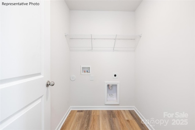 clothes washing area featuring wood finished floors, hookup for an electric dryer, baseboards, laundry area, and washer hookup