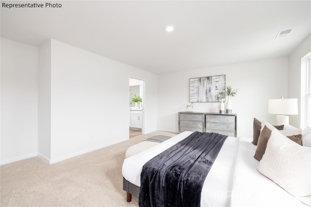 bedroom with baseboards, visible vents, carpet, recessed lighting, and ensuite bath