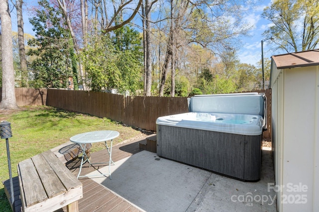 3808 Severn Ave, Charlotte, NC 28210 - wooden terrace featuring a fenced backyard, a hot tub, and a lawn