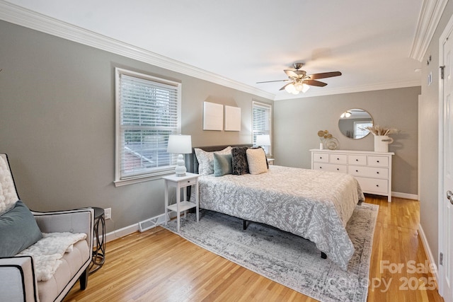 3808 Severn Ave, Charlotte, NC 28210 - bedroom with baseboards, a ceiling fan, light wood-style floors, and crown molding