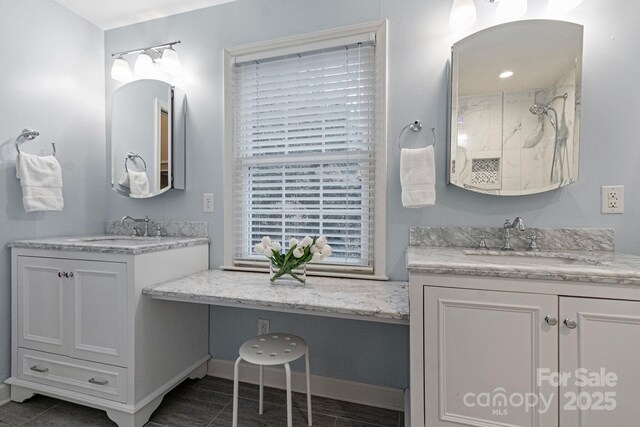 3808 Severn Ave, Charlotte, NC 28210 - full bathroom with baseboards, a shower, a sink, and two vanities