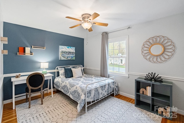 3808 Severn Ave, Charlotte, NC 28210 - bedroom with baseboards, wood finished floors, and a ceiling fan