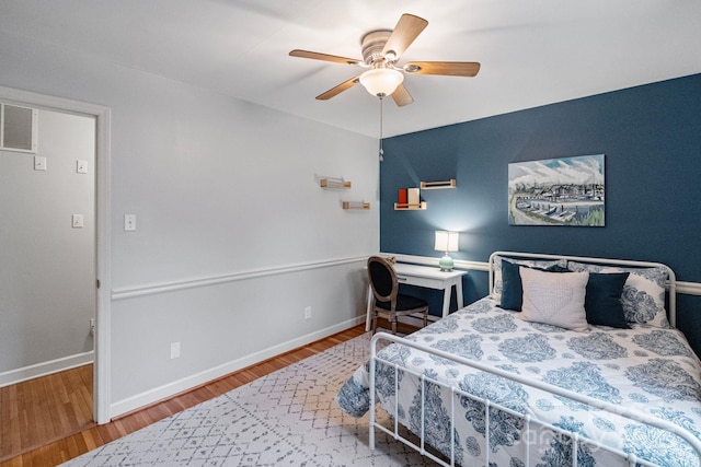 3808 Severn Ave, Charlotte, NC 28210 - bedroom with baseboards, visible vents, wood finished floors, and ceiling fan
