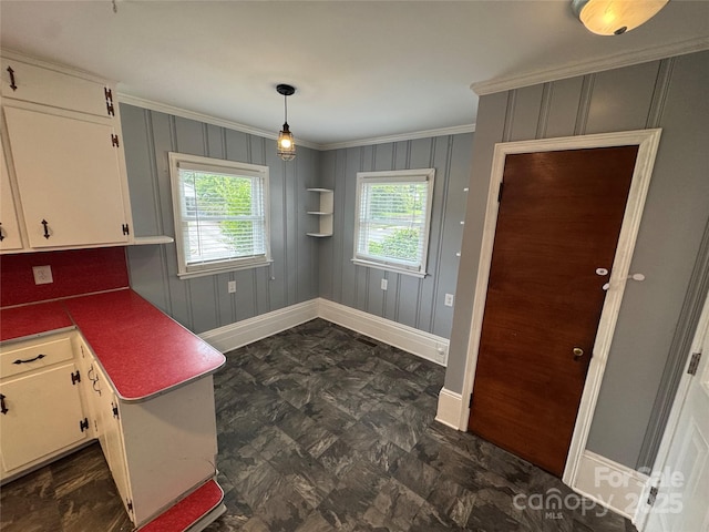 603 E Main St, Rock Hill, SC 29730 - kitchen featuring crown molding, white cabinetry, and hanging light fixtures