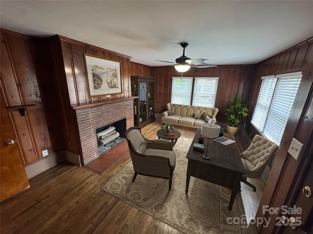 603 E Main St, Rock Hill, SC 29730 - living area featuring wood finished floors, wood walls, ceiling fan, and a brick fireplace