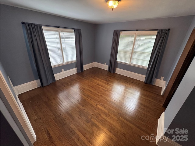 603 E Main St, Rock Hill, SC 29730 - spare room featuring dark wood-type flooring and baseboards