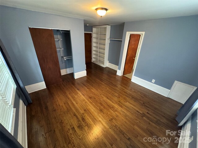 603 E Main St, Rock Hill, SC 29730 - unfurnished bedroom with two closets and dark wood finished floors