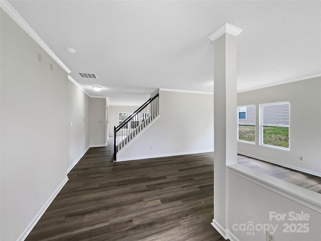 hall featuring stairs, wood finished floors, visible vents, and baseboards