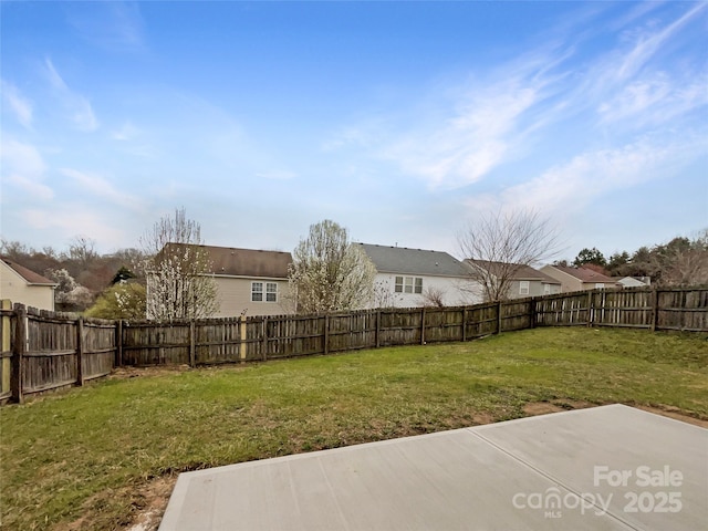 view of yard with a patio and a fenced backyard