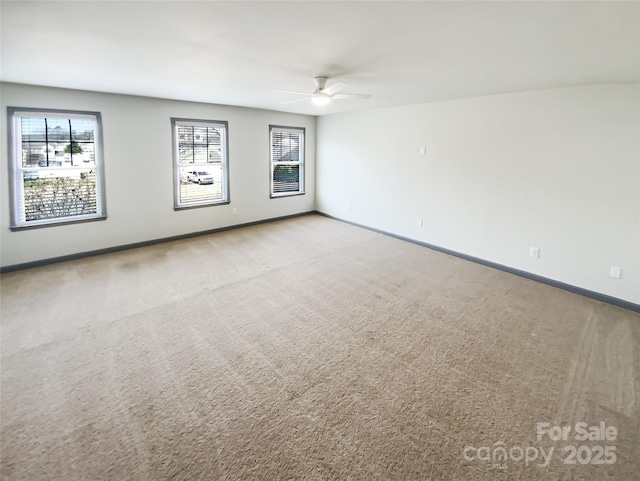 5006 Brodie Ln, Fort Mill, SC 29707 - spare room with baseboards, carpet floors, and ceiling fan